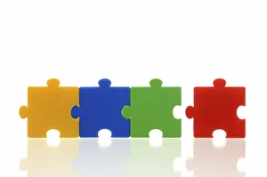 Different coloured puzzle pieces, three puzzle pieces connected, one single puzzle piece, symbolic image for team Different coloured puzzle pieces, three puzzle pieces connected, one single puzzle piece, symbolic image for team