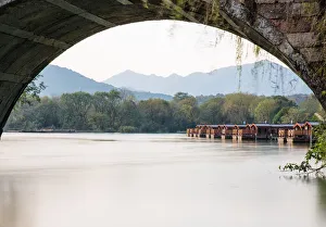 The dock seen from an arch of a stone bridge in Maojiabu Village, Hangzhou, China The dock seen from an arch of a stone bridge in Maojiabu Village, Hangzhou, China