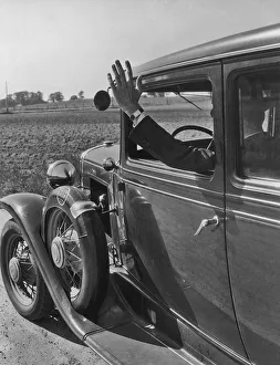 <b class=qtipBold><figcaption>Driving Hand Signals</figcaption></b><br>A driver shows he wishes to turn right by using a hand signal circa 1930's (Photo by Keystone View/FGP/Getty Images)<br><em>© 2010 Getty Images</em> Driving Hand Signals