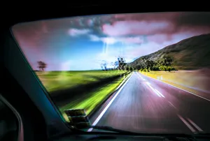 Driving under the influence of drugs, danger to road traffic, driving on the left, view from inside a car on the road Driving under the influence of drugs, danger to road traffic, driving on the left, view from inside a car on the road