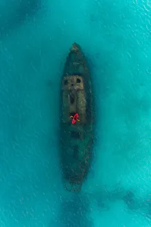 Drone shot directly above a red kayak floating above a shipwreck, Carlisle Bay, Barbados Drone shot directly above a red kayak floating above a shipwreck, Carlisle Bay, Barbados