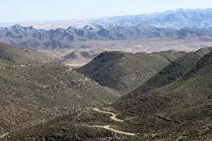 Richtersveld Cultural and Botanical Landscape Collection: Dry valley with road in a Karoo landscape at Helskloof Pass, Richtersveld National Park, Namaqualand