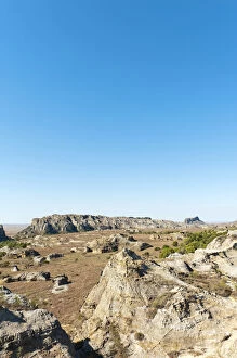 Toliara Collection: Dry and wide erosional landscape with rocks and trees, Isalo National Park, at Ranohira, Madagascar