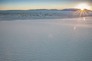 Dunes at White Sands National Monument with San Andres Mountains on horizon at sunset Dunes at White Sands National Monument with San Andres Mountains on horizon at sunset