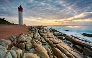 Lighthouses Collection: An early morning picturesque stratocumulus sky of the iconic Umhlanga Rocks Lighthouse