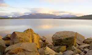 An Early Morning Reflection of a Snow Capped Mountain An Early Morning Reflection of a Snow Capped Mountain