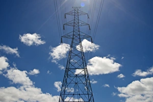 Electricity pylon against a blue sky with clouds Electricity pylon against a blue sky with clouds