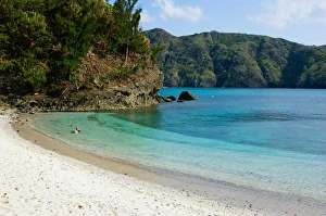 Enjoying clear tropical water of white sandy beach Enjoying clear tropical water of white sandy beach
