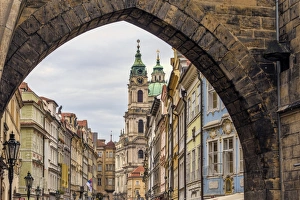 <b class=qtipBold><figcaption>The Entrance to Prague's Lesser Town</figcaption></b><br>A view of the buildings in Nerudova street in Prague's Lesser town, through the archway at the end of Charles Bridge.<br><em>© 2015 Pauline Lewis</em> The Entrance to Prague's Lesser Town