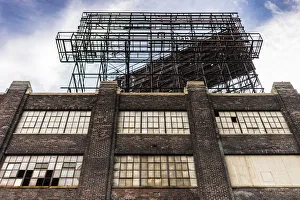 Facade of an old brick industry building with broken windows Facade of an old brick industry building with broken windows