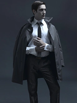 Fashion shot of a man in a suit and jacket Fashion shot of a man in a suit and jacket