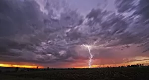 Images Dated 19th December 2010: A Fast Moving African Thunderstorm with a Forked Lightning Strike at Sunset, Magaliesburg
