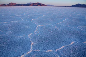 First light on Bonneville Salt Flats near the Utah-Nevada border. The morning light highlights the delicate colors of First light on Bonneville Salt Flats near the Utah-Nevada border. The morning light highlights the delicate colors of