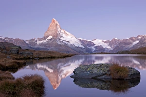 First morning light on Stellisee Lake overlooking Mt Matterhorn with reflections, Zermatt, Valais, Switzerland, Europe First morning light on Stellisee Lake overlooking Mt Matterhorn with reflections, Zermatt, Valais, Switzerland, Europe