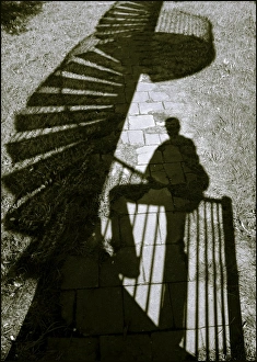 <b class=qtipBold><figcaption>First step up</figcaption></b><br>Shadow of a man climbing an outdoor spiral staircase<br><em>© Josef F. Stuefer</em> First step up