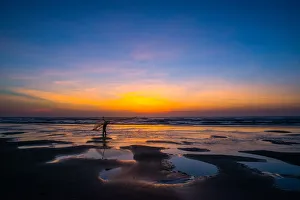 One fisherman hanging fishing tool on the beach at dawn One fisherman hanging fishing tool on the beach at dawn