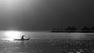 A fisherman on lake Batur, Bali, Indonesia A fisherman on lake Batur, Bali, Indonesia