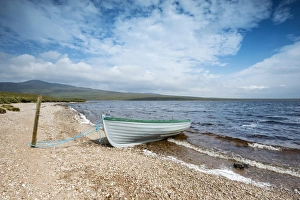 Fishing boat on the shore of Loch Loyal, Sutherland, Scotland, Great Britain, Europe Fishing boat on the shore of Loch Loyal, Sutherland, Scotland, Great Britain, Europe