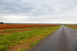 The flat landscape and very red soil farmlands of the Free state, very near to Parys The flat landscape and very red soil farmlands of the Free state, very near to Parys