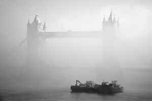 <b class=qtipBold><figcaption>Foggy Morning on the Thames</figcaption></b><br>Tower Bridge and Thames boats are shrouded in atmospheric, dense morning fog.<br><em>© © 2013. Adam Lister</em> Foggy Morning on the Thames
