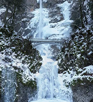 Footbridge over Multnomah Falls in winter, Columbia River Gorge National Scenic Area Footbridge over Multnomah Falls in winter, Columbia River Gorge National Scenic Area