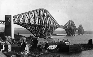 <b class=qtipBold><figcaption>Forth Bridge</figcaption></b><br>A view of the Forth Bridge, over the Firth of Forth, from Queensferry. The steel cantilever construction was designed by John Fowler and Benjamin Baker to carry a double-track railway line and a road over the river. When it was completed in 1890 it was the longest bridge of its kind and considered a great achievement in engineering. (Photo by Hulton Archive/Getty Images) Forth Bridge