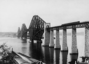 <b class=qtipBold><figcaption>Forth Railway Bridge</figcaption></b><br>A train crossing the Forth Railway Bridge running across the Firth of Forth, circa 1900. The cantilever bridge was opened in 1890 (Photo by Hulton Archive/Getty Images)<br><em>© 2008 Getty Images</em> Forth Railway Bridge