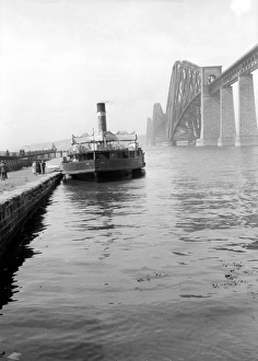 <b class=qtipBold><figcaption>Forth Railway Bridge</figcaption></b><br>circa 1925: A steamer on the River Forth near the Forth Bridge. The Forth Bridge spans the Firth of Forth at Queensferry in Lothian and is over a mile long. The steel cantilever construction was designed by John Fowler and Benjamin Baker to carry a double-track railway line and a road over the river. When it was completed in 1890 it was the longest bridge of its kind and considered a great achievement in engineering. (Photo by Alfred Hind Robinson/A H Robinson/Getty Images)<br><em>© This content is subject to copyright.</em> Forth Railway Bridge