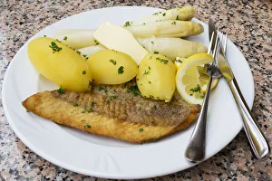Fried salmon with asparagus, butter and boiled potatoes Fried salmon with asparagus, butter and boiled potatoes