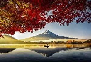 Fuji Mountain and Fisherman Boat with Morning Mist in Autumn, Kawaguchiko Lake, Japan Fuji Mountain and Fisherman Boat with Morning Mist in Autumn, Kawaguchiko Lake, Japan
