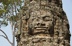 Gate entrance to Angkor Thom with guarding statue Gate entrance to Angkor Thom with guarding statue