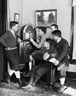 <b class=qtipBold><figcaption>Gather Round</figcaption></b><br>Circa 1930, A group of young Asian men sit down to listen to a radio broadcast. (Photo by FPG/Getty Images) Gather Round
