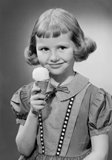 Bobbed Hair Gallery: Girl (6-7) eating ice cream, portrait