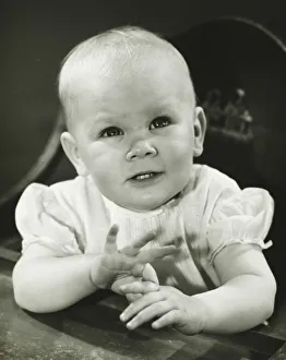 Girl (6-9 months) sitting in high chair, (B&W) Girl (6-9 months) sitting in high chair, (B&W)