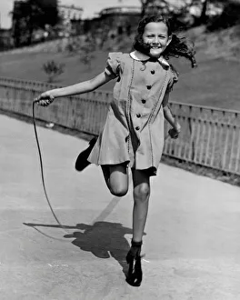 <b class=qtipBold><figcaption>Girl jumping rope</figcaption></b><br>UNITED STATES - CIRCA 1950s: Girl jumping rope.<br><em>© George Marks</em> Girl jumping rope