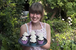Girl presenting her homemade Oreo brownie cupcakes Girl presenting her homemade Oreo brownie cupcakes