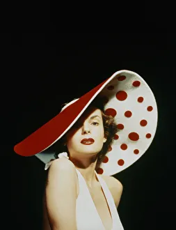 GLAMOROUS WOMAN IN A LARGE RED AND WHITE HAT GLAMOROUS WOMAN IN A LARGE RED AND WHITE HAT