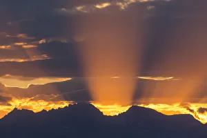 God Rays at sunrise over Wind River Mountains, Fremont and Jackson Peaks in Summer God Rays at sunrise over Wind River Mountains, Fremont and Jackson Peaks in Summer
