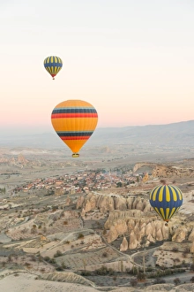 <b class=qtipBold><figcaption>Good morning Cappadocia</figcaption></b><br>Vertical image of Hot Air Balloons flying over Volcanic Rock canyons in Cappadocia, Turkey<br><em>© Copyright Stefan Cioata</em> Good morning Cappadocia