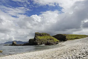 Grass-covered limestone cliffs on a wide pebble beach, County Donegal, Ireland, Europe Grass-covered limestone cliffs on a wide pebble beach, County Donegal, Ireland, Europe