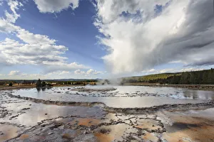 Great Fountain Geyser in Lower Geyser Basin on sunny day, Yellowstone National Park Great Fountain Geyser in Lower Geyser Basin on sunny day, Yellowstone National Park