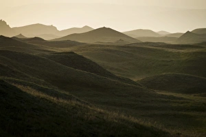 Green hills in back light, meadow, at Kirkjubaejarklaustur, South Iceland, Iceland, Europe Green hills in back light, meadow, at Kirkjubaejarklaustur, South Iceland, Iceland, Europe