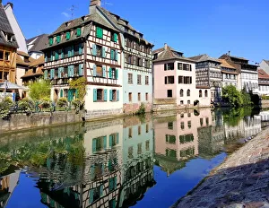 Half-timbered houses reflected in the Ill river, Strasbourg, France Half-timbered houses reflected in the Ill river, Strasbourg, France