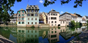 Half-timbered houses reflected in the Ill river, Strasbourg, France Half-timbered houses reflected in the Ill river, Strasbourg, France