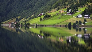 Hamlet of Heggland reflected in Lake Oppheimsvatnet, Oppheim, Hordaland, Norway Hamlet of Heggland reflected in Lake Oppheimsvatnet, Oppheim, Hordaland, Norway