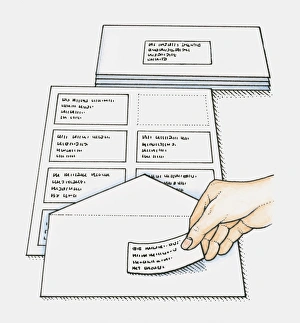 Hand sticking pre-printed address labels on envelopes Hand sticking pre-printed address labels on envelopes