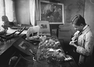 <b class=qtipBold><figcaption>Hand Made Toys</figcaption></b><br>circa 1930: A toy maker carving toy animals in his workshop. (Photo by Hulton Archive/Getty Images) Hand Made Toys