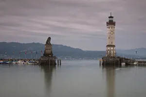 Harbour entrance of Lindau on Lake Constance with the old lighthouse and the Bavarian lion statue, Bavaria, Germany Harbour entrance of Lindau on Lake Constance with the old lighthouse and the Bavarian lion statue, Bavaria, Germany