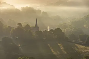 Hathersage church surrounded by the hills of the Peak District at sunrise. UK Hathersage church surrounded by the hills of the Peak District at sunrise. UK