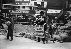 <b class=qtipBold><figcaption>Hatry Crisis</figcaption></b><br>1930: An Evening Standard newspaper vendor carrying a poster saying 'Hatry Crisis, Banks Dilemma', referring to financier Clarence Charles Hatry, a self-confessed forger who was sentenced in 1930 to 14 years penal servitude but released in 1939. (Photo by General Photographic Agency/Getty Images) Hatry Crisis